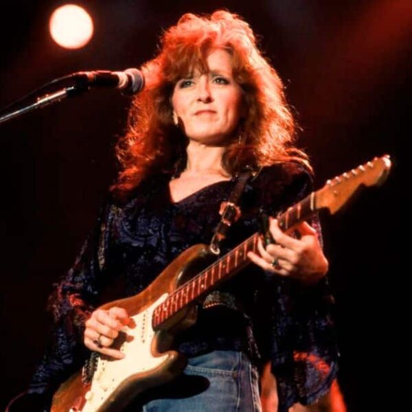 Bonnie Raitt performs at Farm Aid in the Hoosier Dome, Indianapolis, Indiana, April 7th, 1990. Photo by PAUL NATKIN